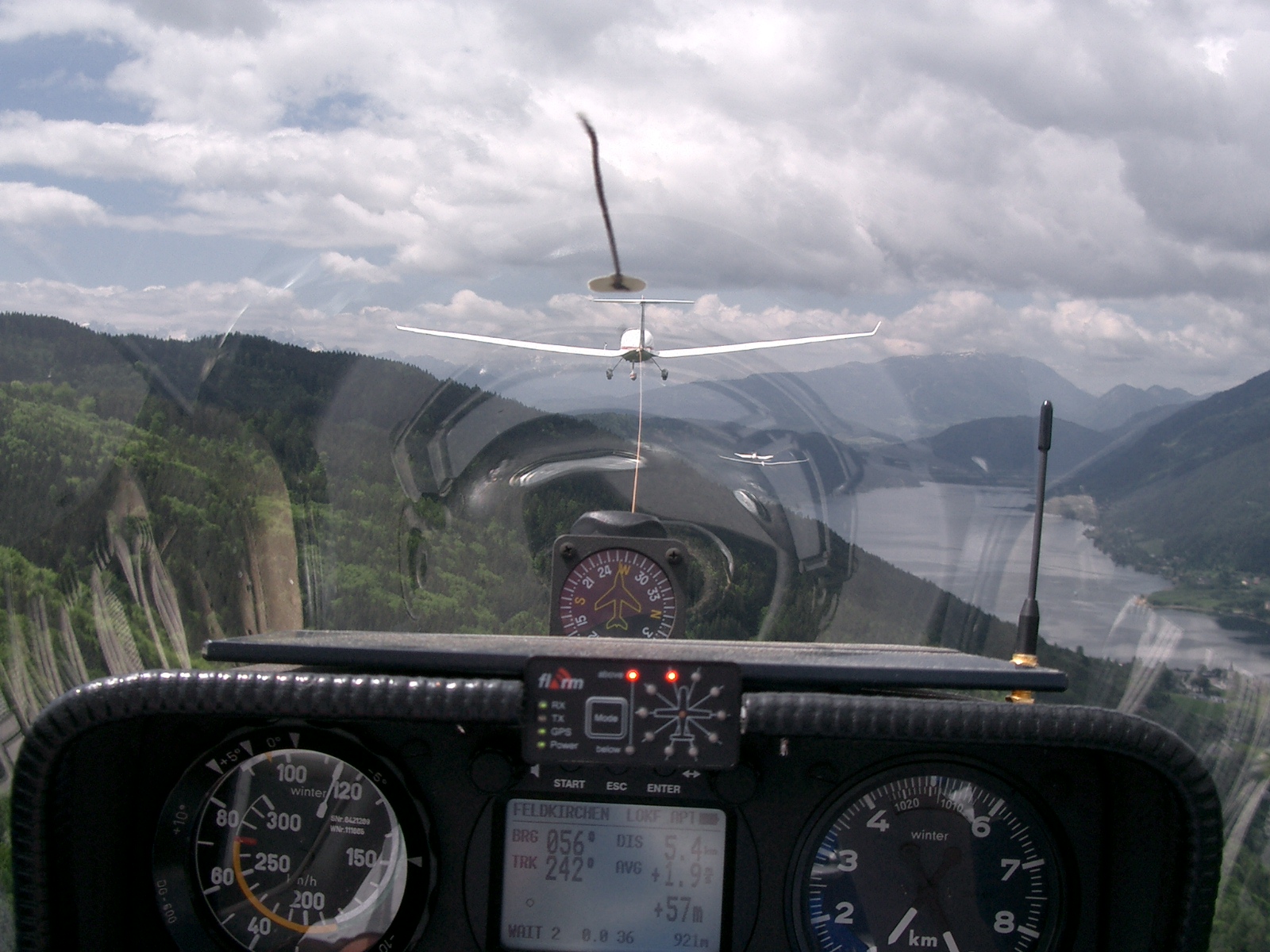 Cockpit of a plane with view to a lake
