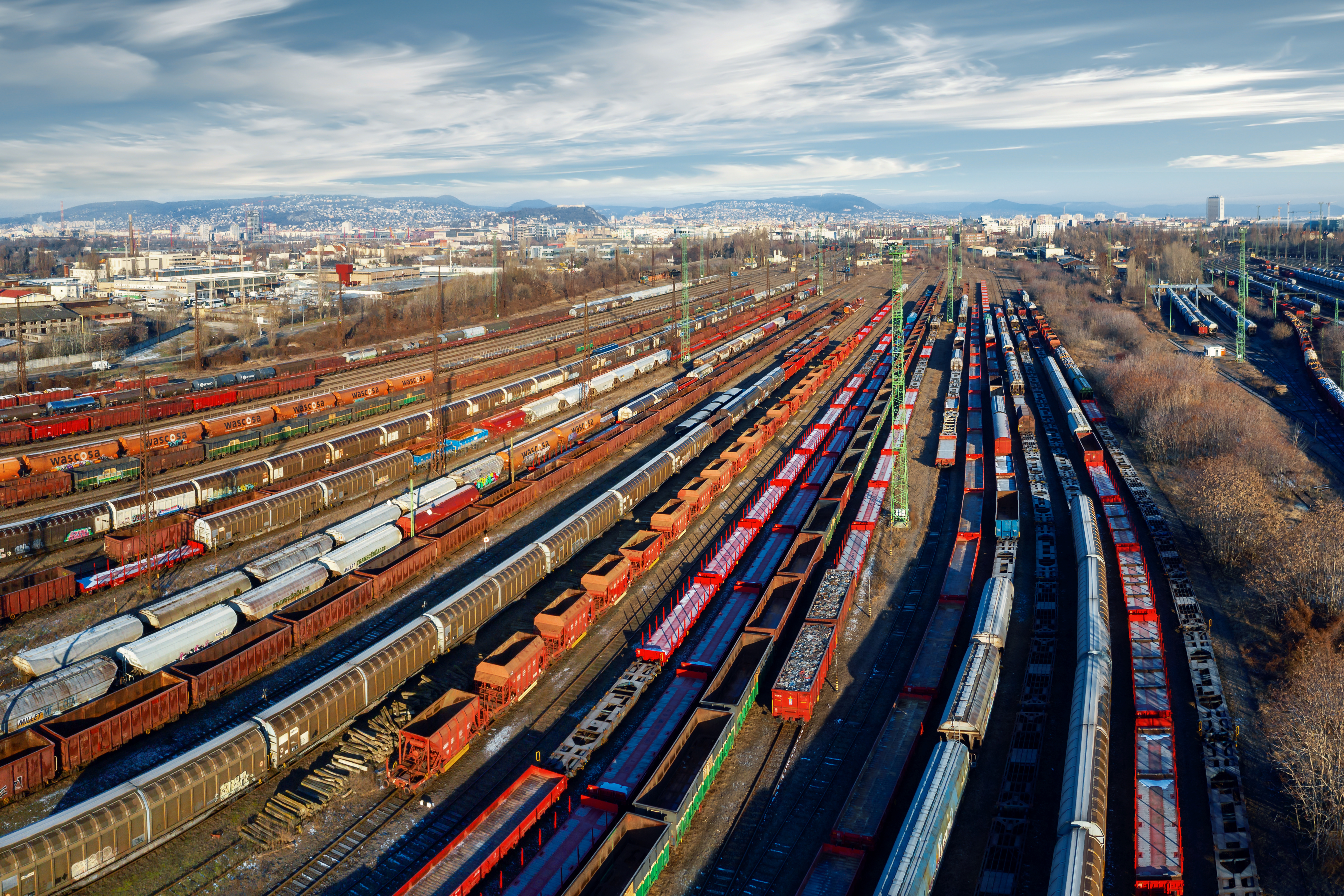 Railway yard with trains illustrating low-power GNSS asset tracking with u-blox F11