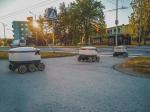 autonomous delivery robots crossing the street