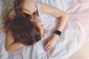 woman sleeping with her tracker on the wrist