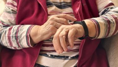 Person interacting with a smartwatch for wearable health monitoring