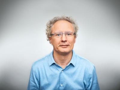 We Swiss are perfectionists. Confident businessman on white background. Portrait of professional is wearing eyeglasses and blue shirt. He is in studio.