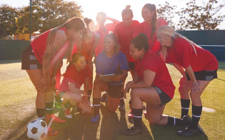 Image of football players discussing performance