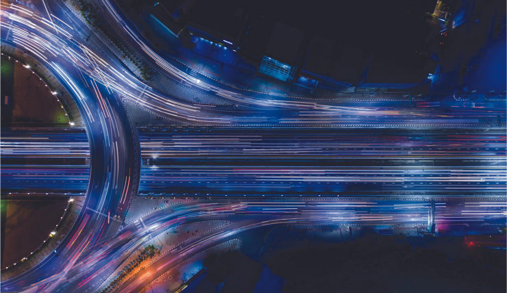 image to show intersection of roads at night