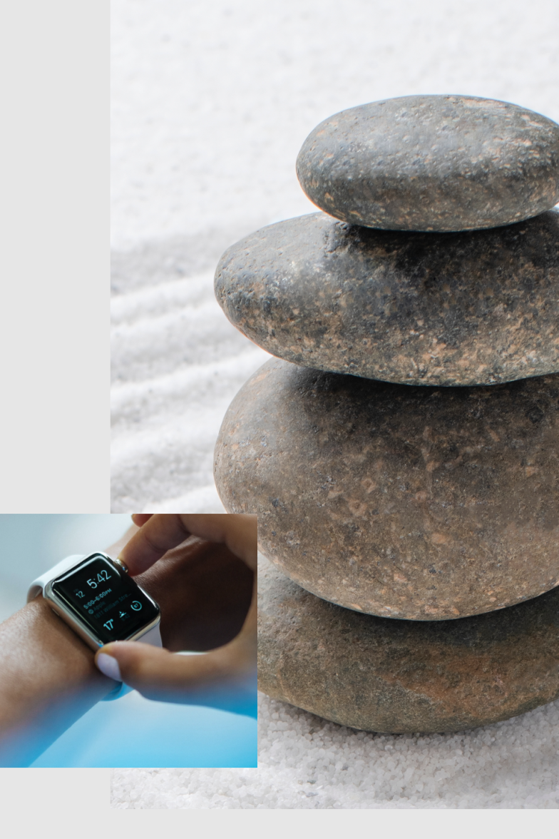 pile of stones and smartwatch