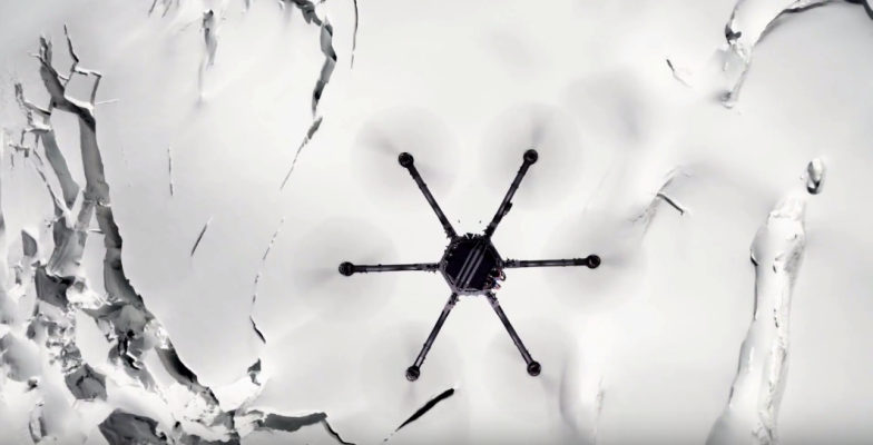 Drone flying over snow