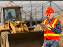 the excavator operator checks his positions on the tablet 