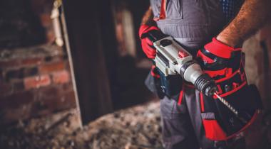 Person holding power drill 