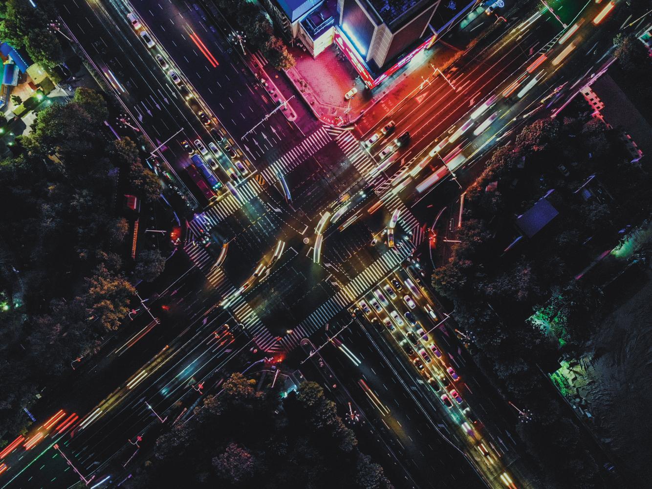 Bird's eye view on busy city intersection at night