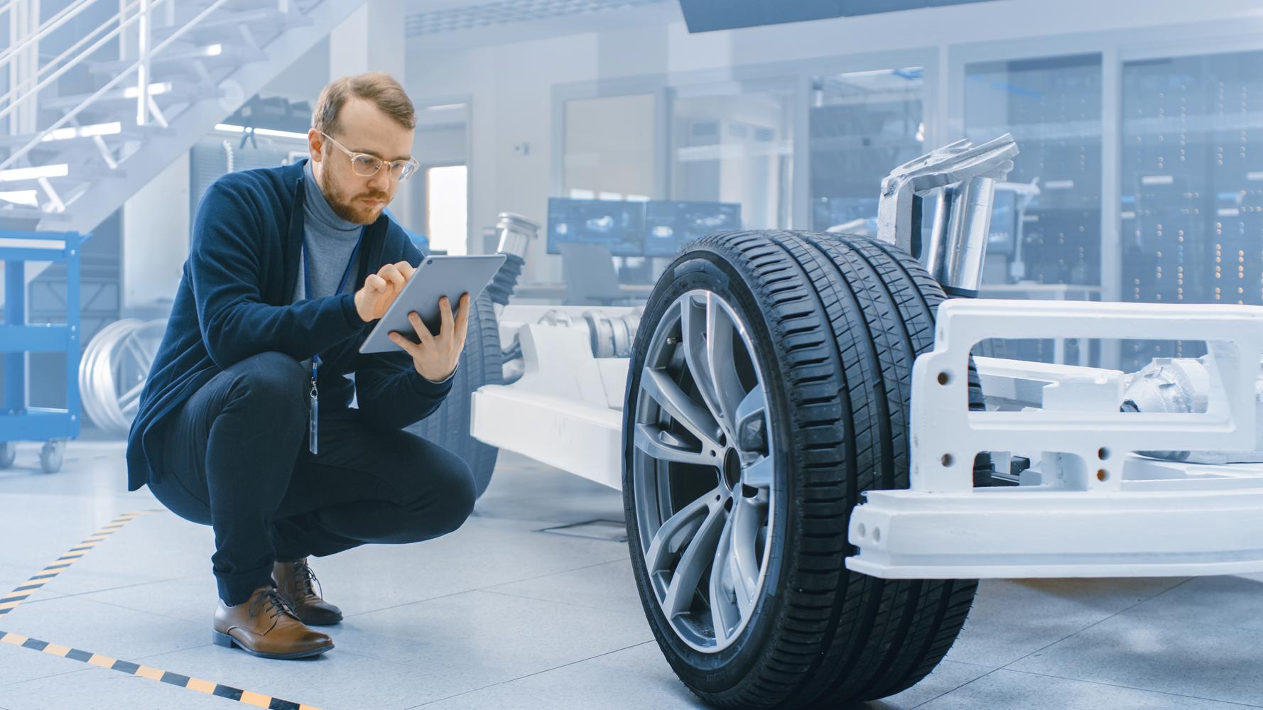 An engineer checking the chassis settings in the futuristic laboratory